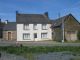 Corlay area, traditionnal house with attached outbuildings.