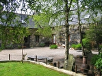 Close to Mur de Bretagne-Stone property in a pleasant setting